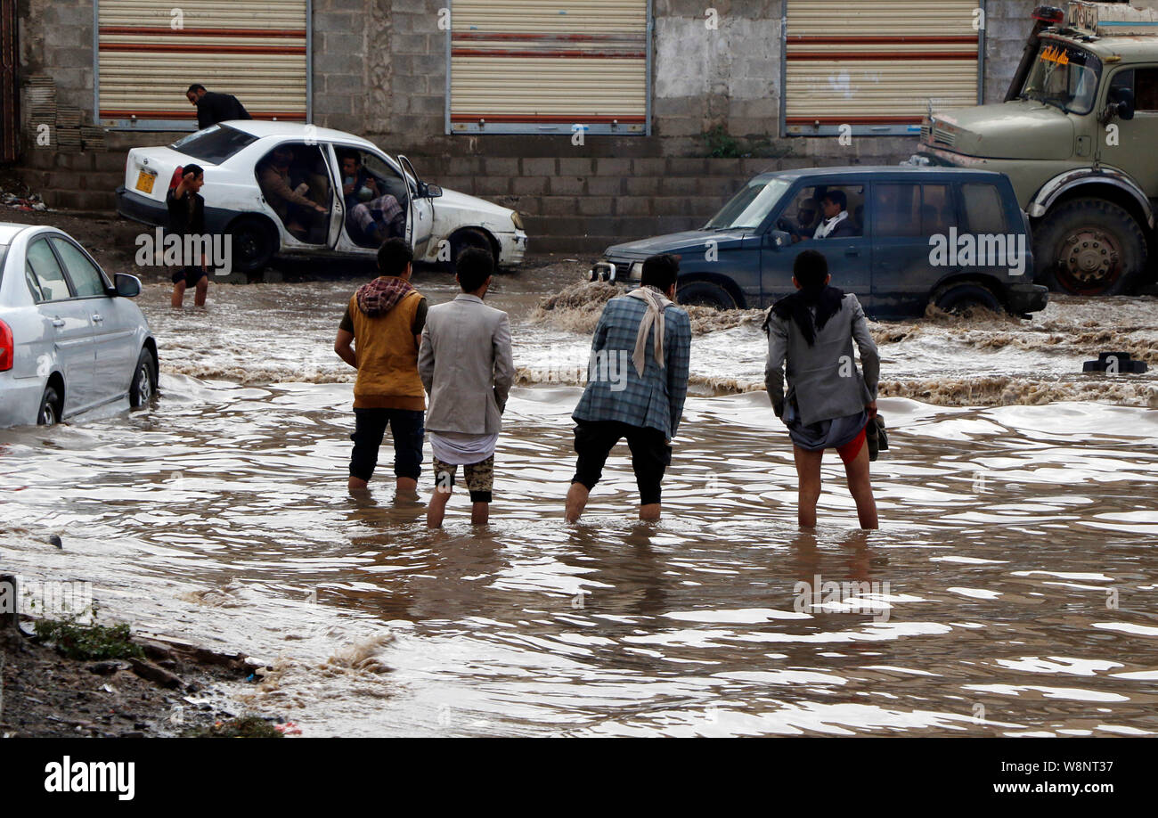 People Walk Through Flooded Street High Resolution Stock Photography ...