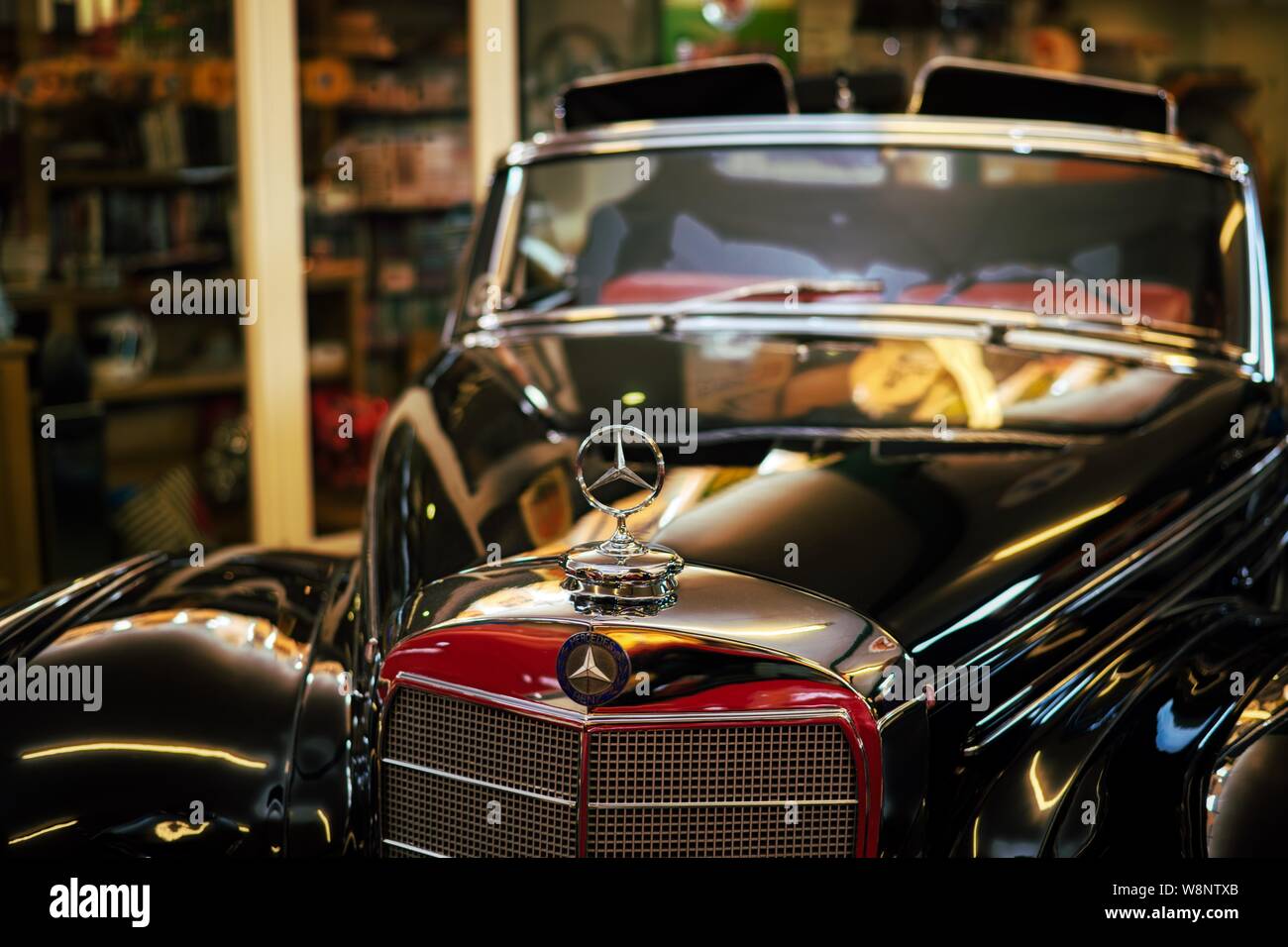 Shiny Black Mercedes Benz in the private car museum at a car show staged by Robert and Tanya Lewis at Old Kiln Farm, Churt, Surrey, UK Stock Photo