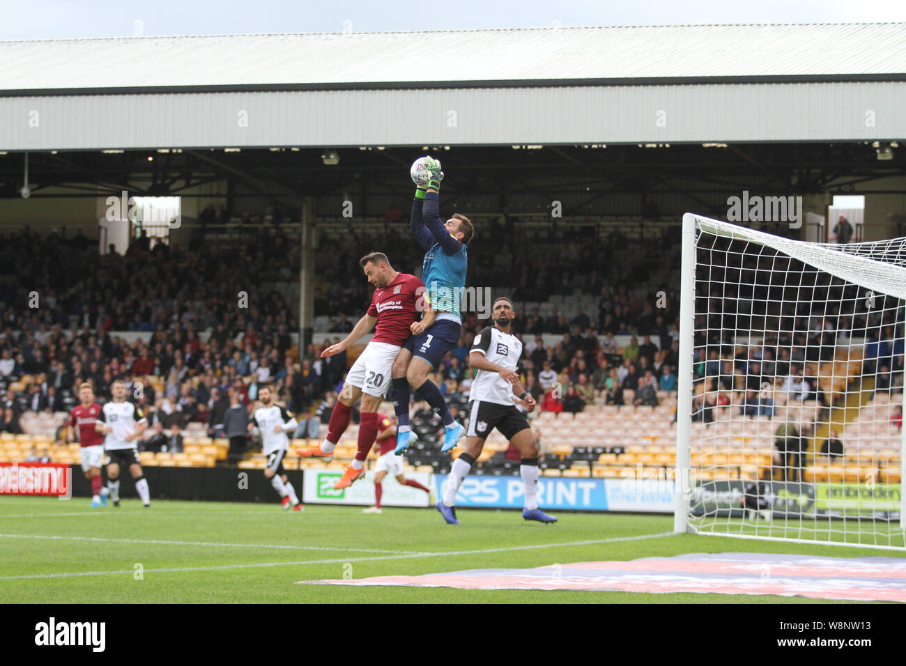 Stoke on trent, UK. 10th August, 2019. Scott Brown of Port Vale catches the ball before it can be claimed by Matt Warburton of Northampton Town during the Sky Bet League 2 match between Port Vale and Northampton Town at Vale Park, Burslem on Saturday 10th August 2019. (Credit: Tina Newbury | MI News) Editorial use only, license required for commercial use. Photograph may only be used for newspaper and/or magazine editorial purposes Credit: MI News & Sport /Alamy Live News Stock Photo