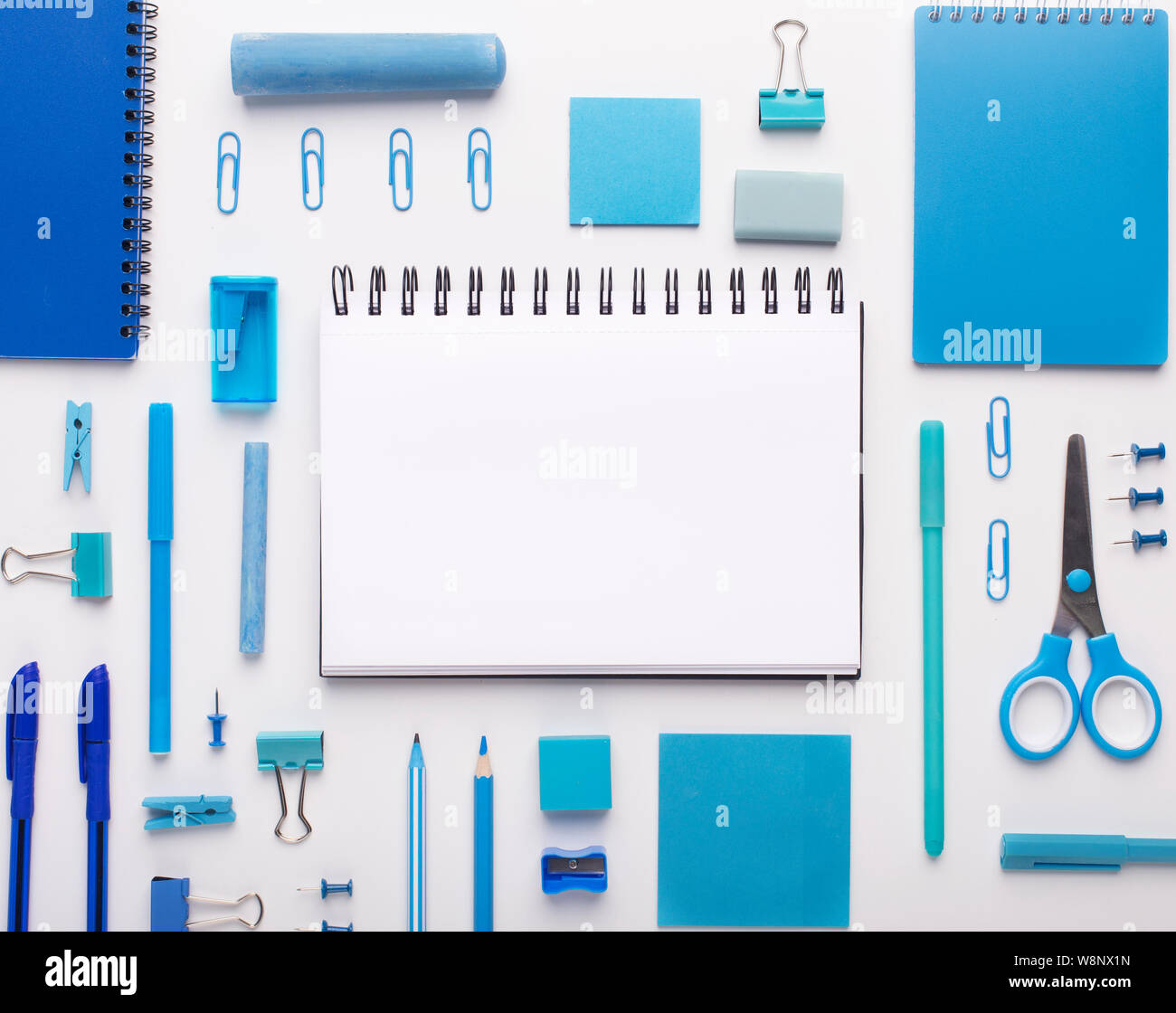 Blue colored office stationery, notepad with blank space on white Stock Photo