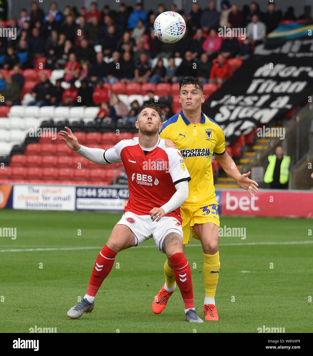 London, UK. 10th August, 2019. English Football League One, Fleetwood Town  versus Wimbledon; Wes Burns of Fleetwood Town keeps his eye on the ball and  wins the aerial duel with Callum Reilly