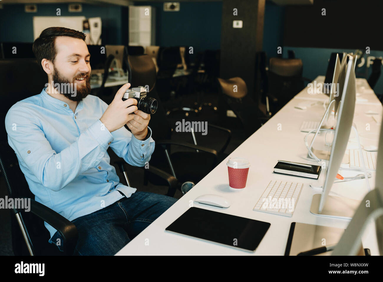 Photo cheerful man sitting hi-res stock photography and images - Alamy