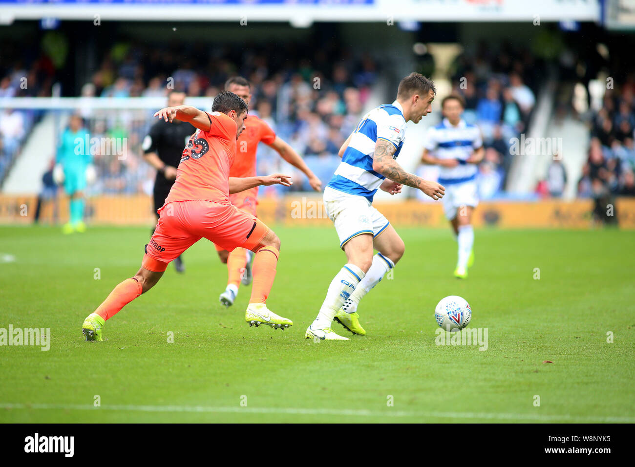 London, UK. 10th Aug, 2019. Jordan Hugill of Queens Park Rangers and Christopher Schindler of Huddersfield Town (l) during EFL Skybet Championship match, Queens Park Rangers v Huddersfield Town at The Kiyan Prince Foundation Stadium, Loftus Road in London on Saturday 10th August 2019. this image may only be used for Editorial purposes. Editorial use only, license required for commercial use. No use in betting, games or a single club/league/player publications. pic by Tom Smeeth/Andrew Orchard sports photography/Alamy Live news Credit: Andrew Orchard sports photography/Alamy Live News Stock Photo