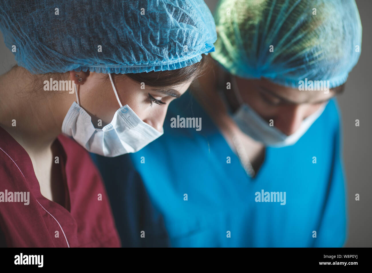 Portrait of surgeons at work, operating in uniform Stock Photo - Alamy