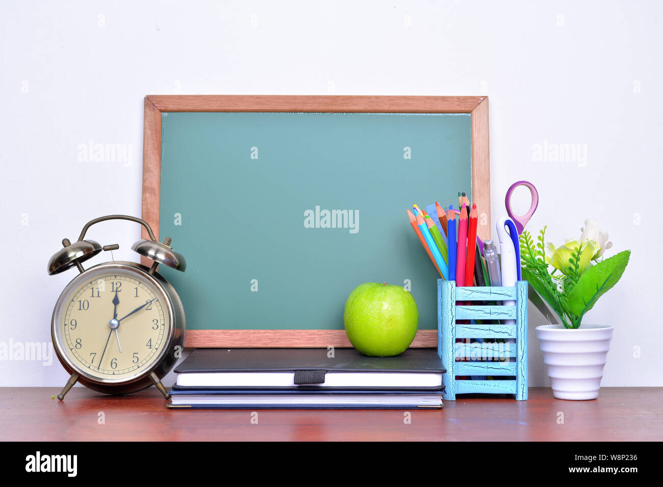 Back to school concept with books and alarm clock with chalkboard Stock ...