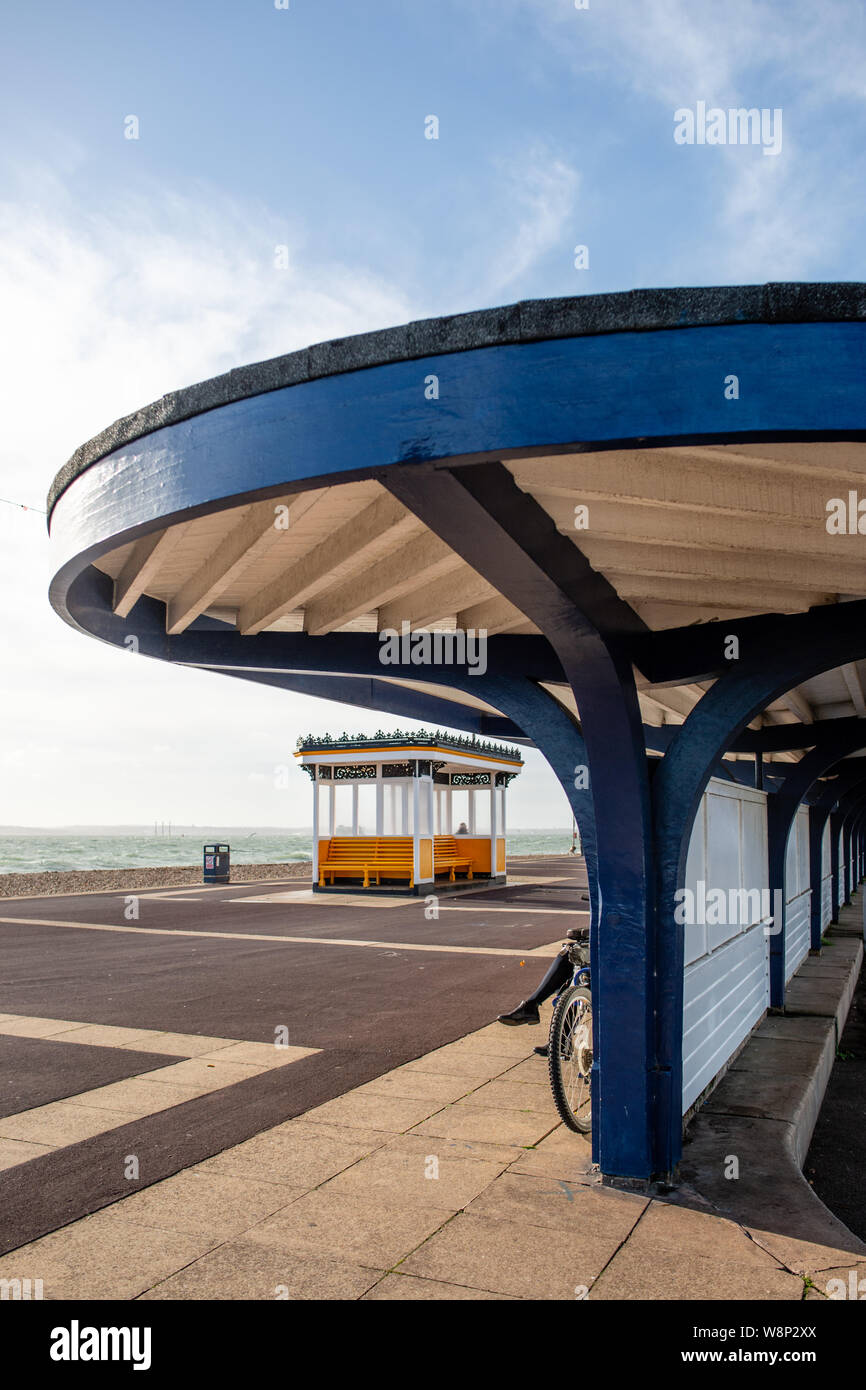 Shelter and seaside shelter in Southsea promenade. The Solent and Isle of Wight are visible in the background. Stock Photo