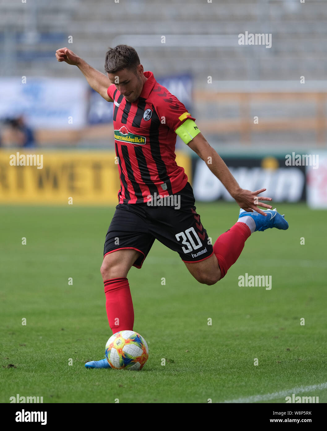 Magdeburg, Germany. 10th Aug, 2019. Soccer: DFB Cup, 1st FC Magdeburg - SC Freiburg, 1st round in the MDCC Arena. Freiburg's Christian Günter is on the ball. Credit: Peter Steffen/dpa - IMPORTANT NOTE: In accordance with the requirements of the DFL Deutsche Fußball Liga or the DFB Deutscher Fußball-Bund, it is prohibited to use or have used photographs taken in the stadium and/or the match in the form of sequence images and/or video-like photo sequences./dpa/Alamy Live News Stock Photo