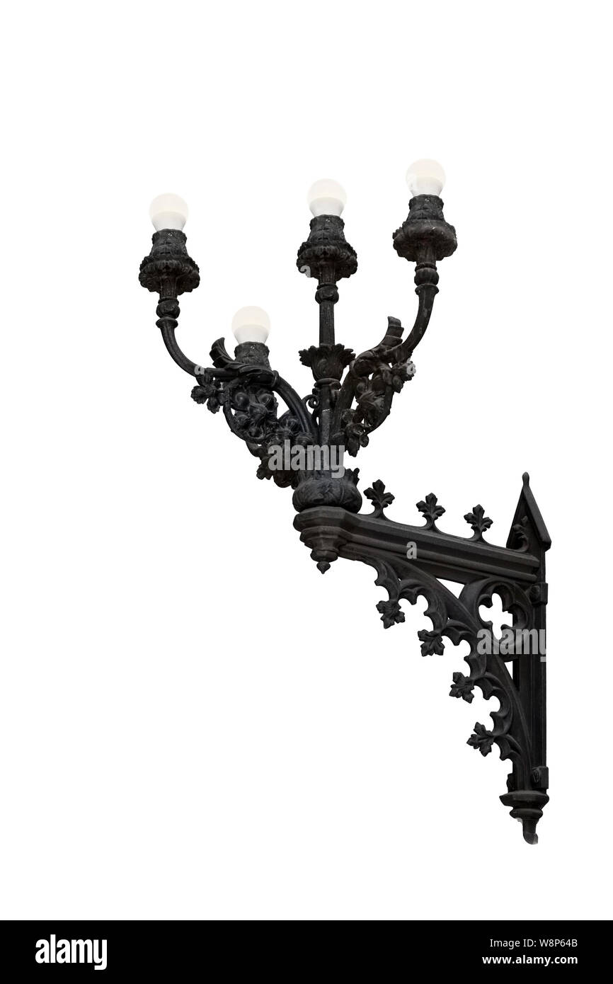 Medieval wall lamp in wrought iron isolated on white background Stock Photo
