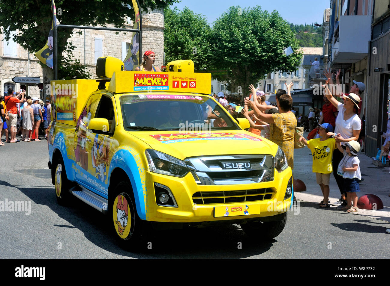 Passage of a car from Mickey's newspaper in the Tour de France caravan in Anduze Stock Photo