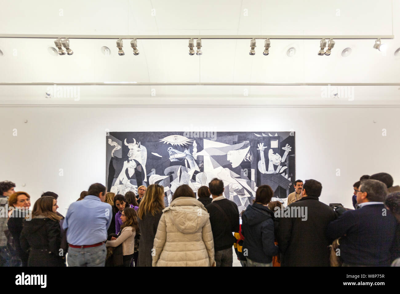 People looking the Guernica painting by Pablo Picasso. Museo Reina Sofía is Spain's national museum of 20th-century art. Stock Photo