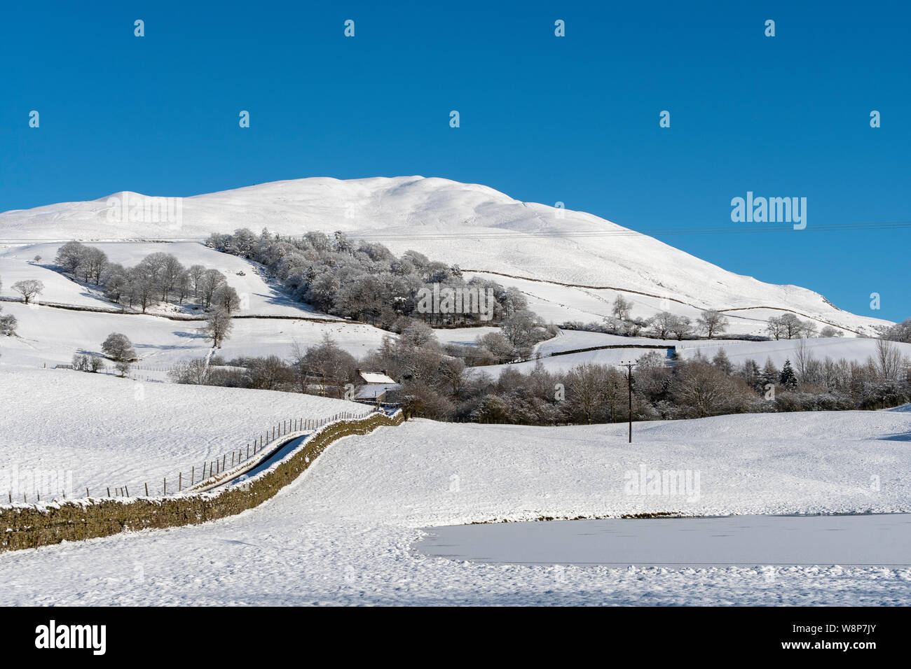 Winder Hill behind Sedbergh covered in snow. Yorkshire Dales National Park, Cumbria, UK. Stock Photo