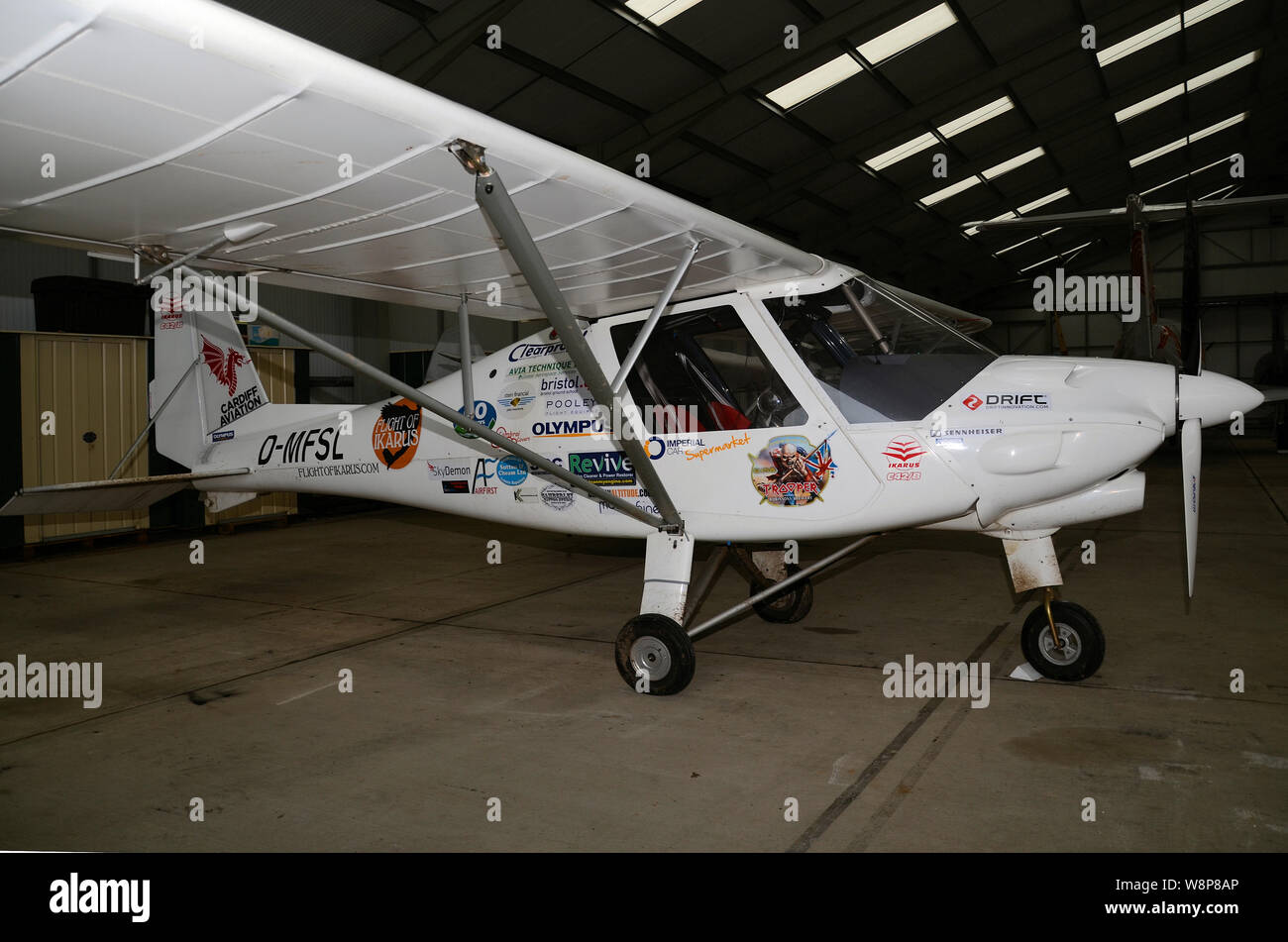 Ikarus C42 D-MFSL general aviation microlight aircraft, manufactured in Germany by Comco Ikarus. Flight of Ikarus record attempt aircraft with sponsor Stock Photo