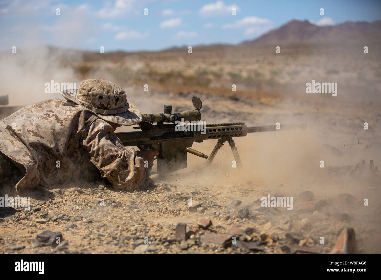 A U.S. Marine with Scout Sniper Platoon, Weapons Company, 1st Battalion, 25th Marine Regiment, 4th Marine Division battle sight zeros a Special Aplication Scoped Rifle, on Twenty-Nine Palms, Calif. July 26, 2019. The Marines of Scout Sniper Platoon executed Know and Unknown Distance ranges in order to prepare themselves for Inegrated Training Exercize 5-19. (U.S. Marine Corps photo by Lance Cpl. Tyler M. Solak) Stock Photo