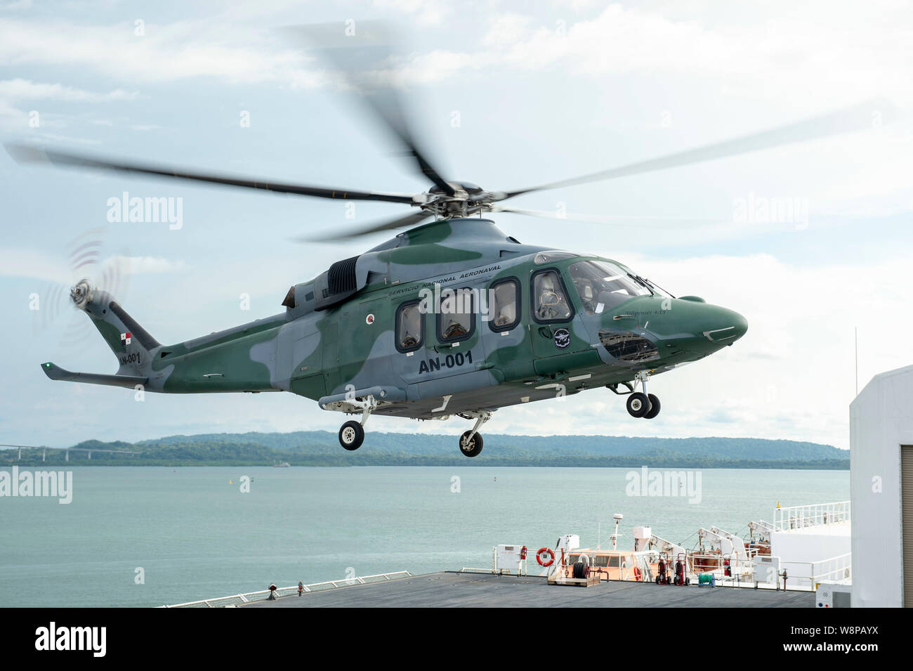 190808-N-DZ642-1094 COLON, Panama (Aug. 8, 2019) An AW-139 helicopter, assigned to Panama's Servicio Nacional Aeronaval, carrying Panamanian President Laurentino Cortizo, lands on the flight deck of the hospital ship USNS Comfort (T-AH 20). Comfort is working with health and government partners in Central America, South America, and the Caribbean to provide care on the ship and at land-based medical sites, helping to relieve pressure on national medical systems strained by an increase in Venezuelan migrants. (U.S. Navy photo by Mass Communication Specialist 2nd Class Bobby J Siens) Stock Photo