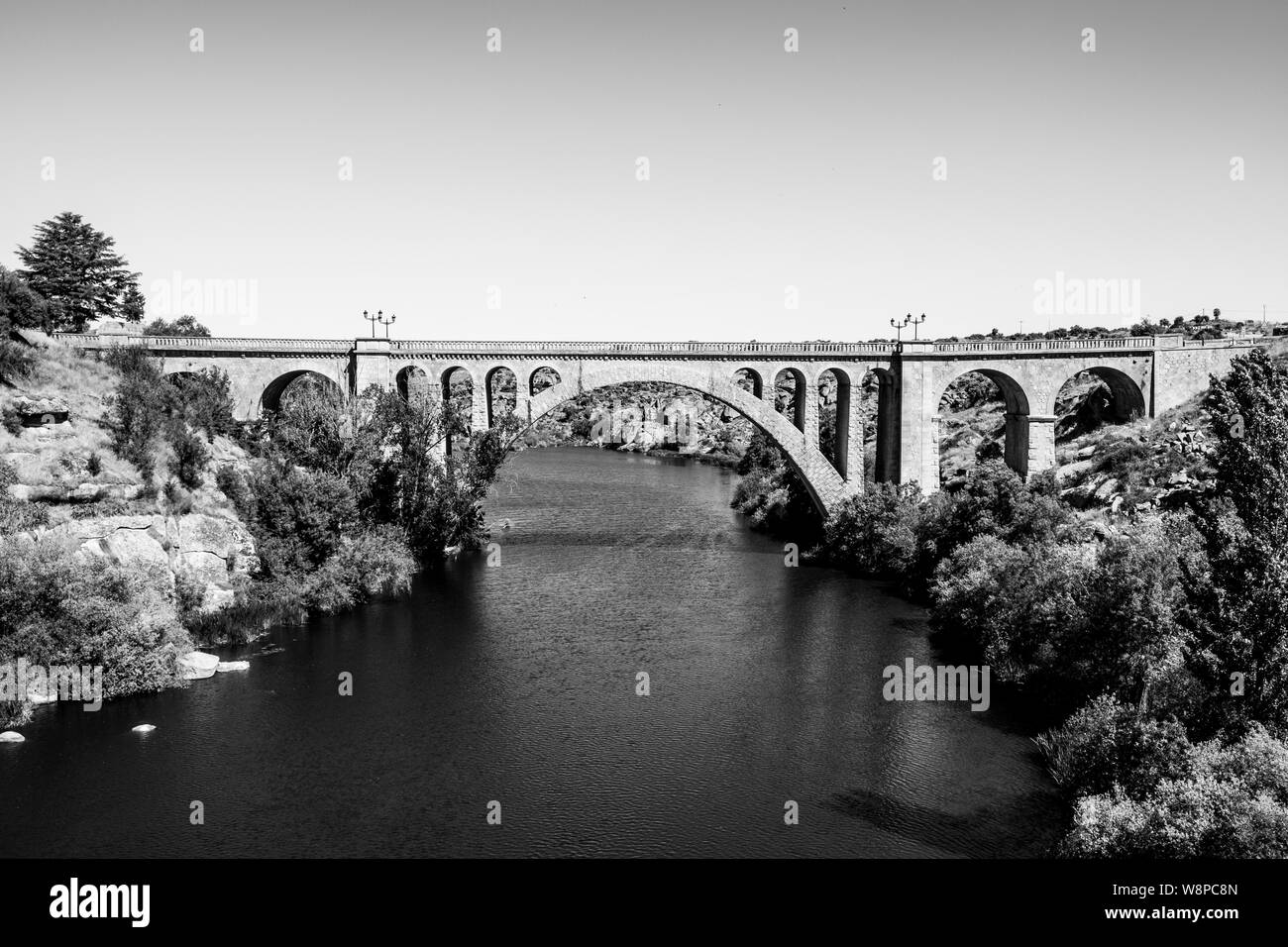 Old bridge over Tormes river in Ledesma, Salamanca, Spain Stock Photo