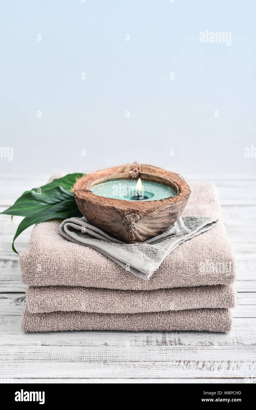 Cozy spa composition of aroma of candles and bath towels, soap. Body care  and hygiene concept Stock Photo - Alamy