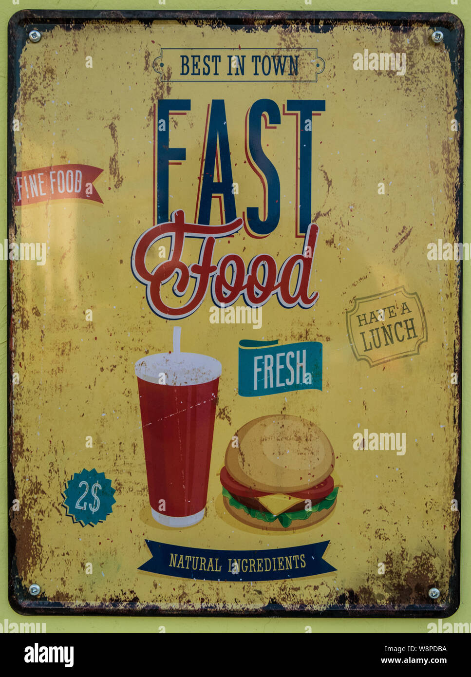 A vintage sign advertising some fast food on a food truck. Stock Photo