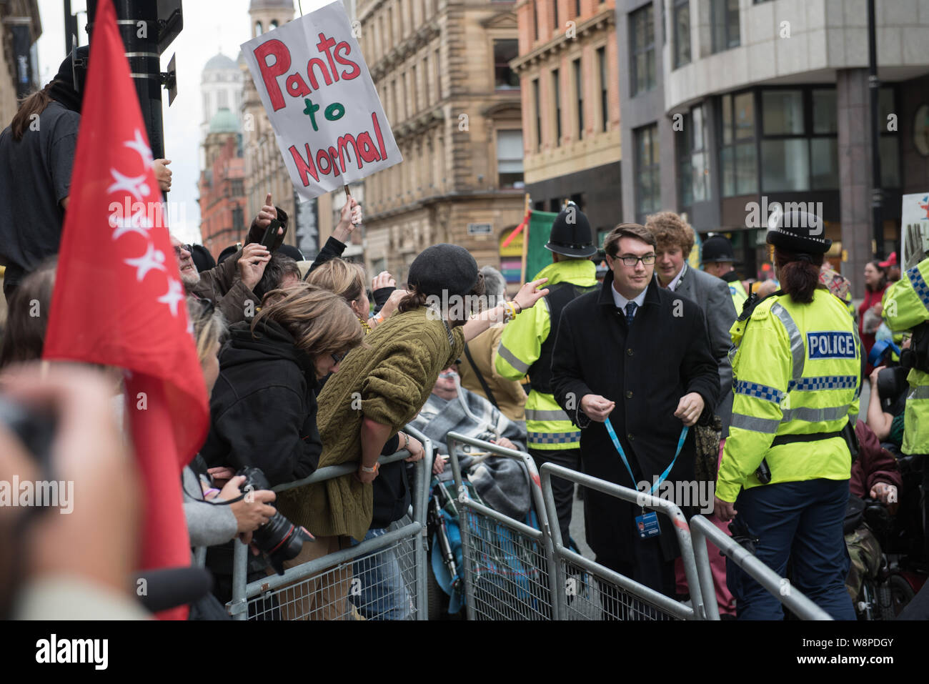 Peter Street, Manchester, UK. 5th October 2015. Anti-Tory protesters shout abuse and throw plastic balls at Tory Cabinet members and other delegates a Stock Photo