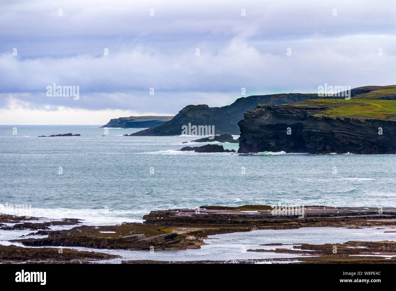 Surrounding the seaside town of Kilkee, County Clare, Ireland are interesting cliffs with many unique rock formations Stock Photo