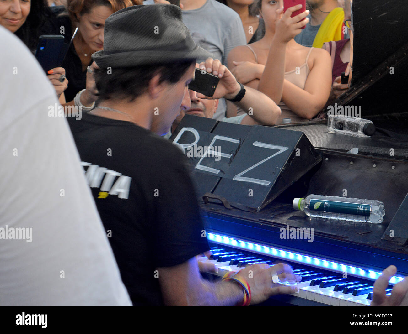 BUCHAREST, ROMANIA - 10 AUGUST 2019: Davide Martello cancelled concerts in Germany to play piano in the centre of the demonstration marking the anniversary of the attack by gendarmes Stock Photo