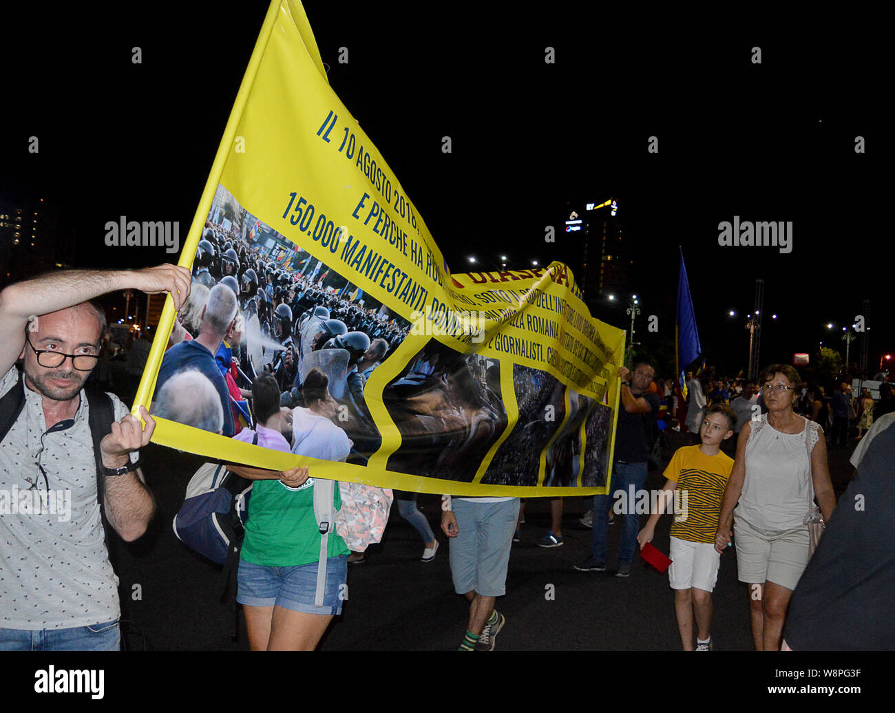 BUCHAREST, ROMANIA - 10 AUGUST 2019: Around 20,000 people protest in Piata Victoriei on the anniversary of the gendarmes attacking protestors, this a banner from members of the diaspora in Milan, Italy Stock Photo