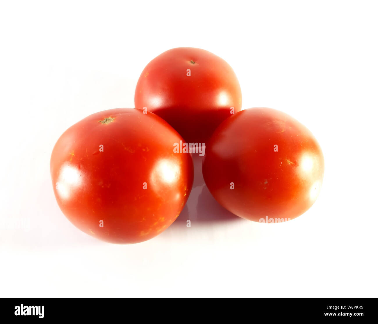 Red tomato on white background. Summer closeup view. Vegan food isolated photo Stock Photo