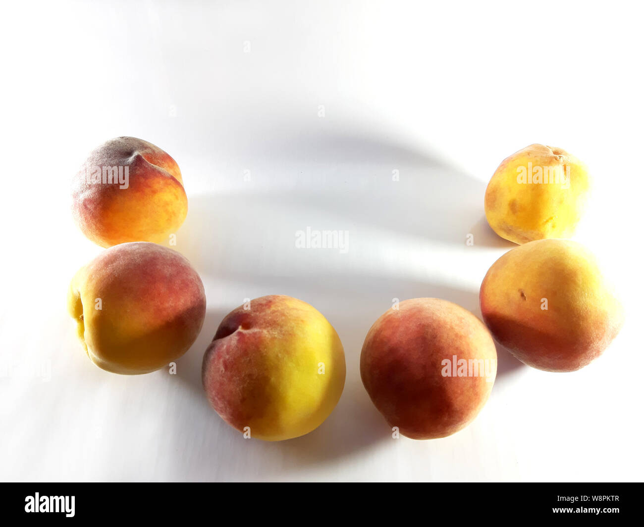 Photo frame peach. Summer fruits, white background photo Stock Photo