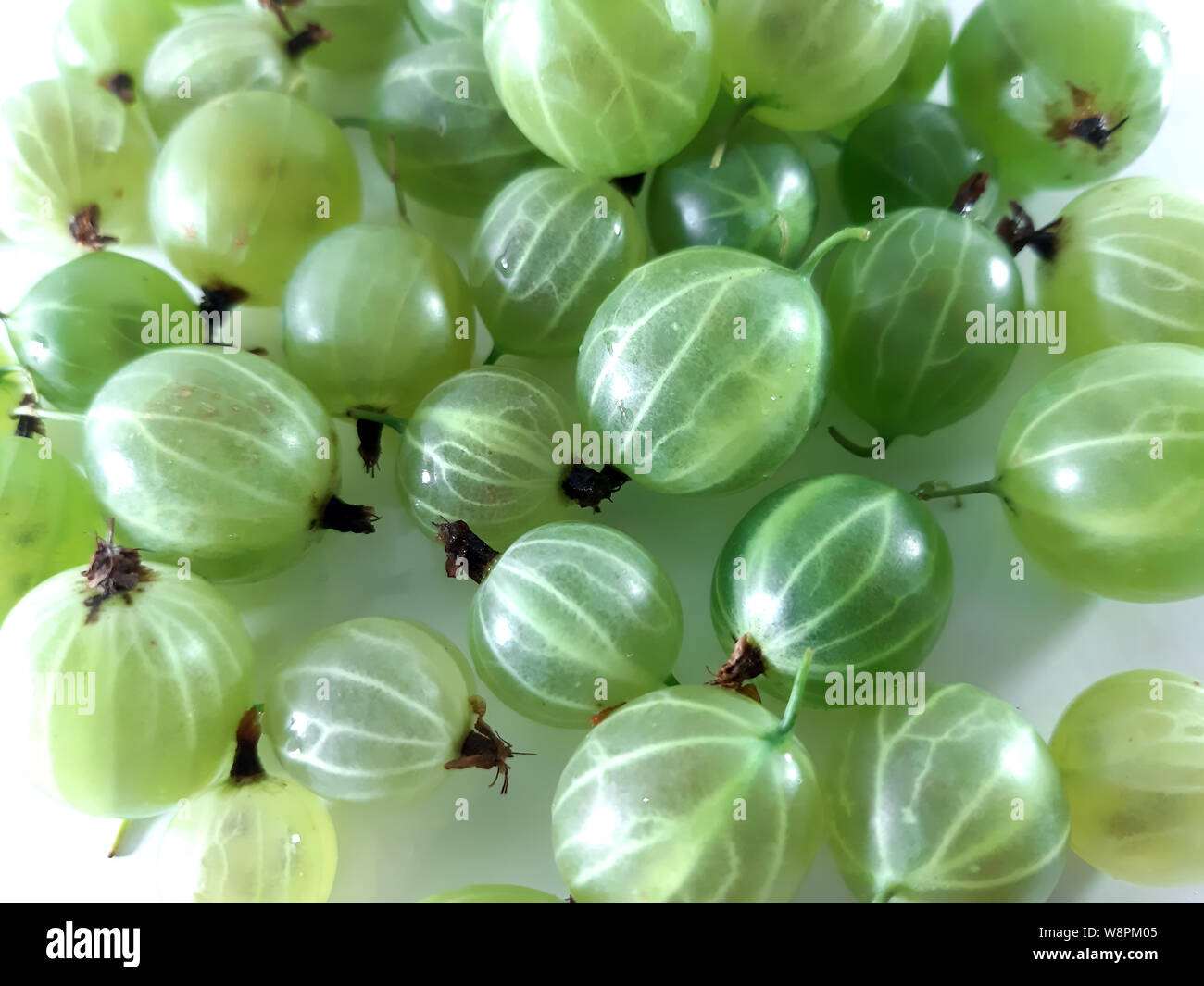 Green gooseberry, nature background. Vegetarian, diet food, photo background nature Stock Photo
