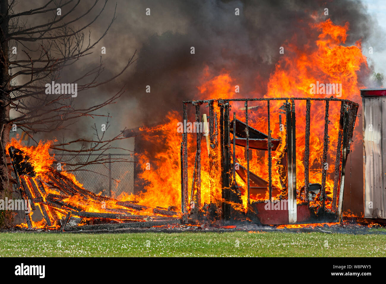 Raging fire destroys building structure Stock Photo