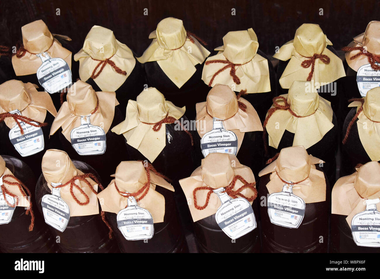 JULY 14, 2019-Vigan Philippines : Ilocos Sur local vinegar sealed with a paper ribbon sold at the streets of Vigan in the Philippines Stock Photo