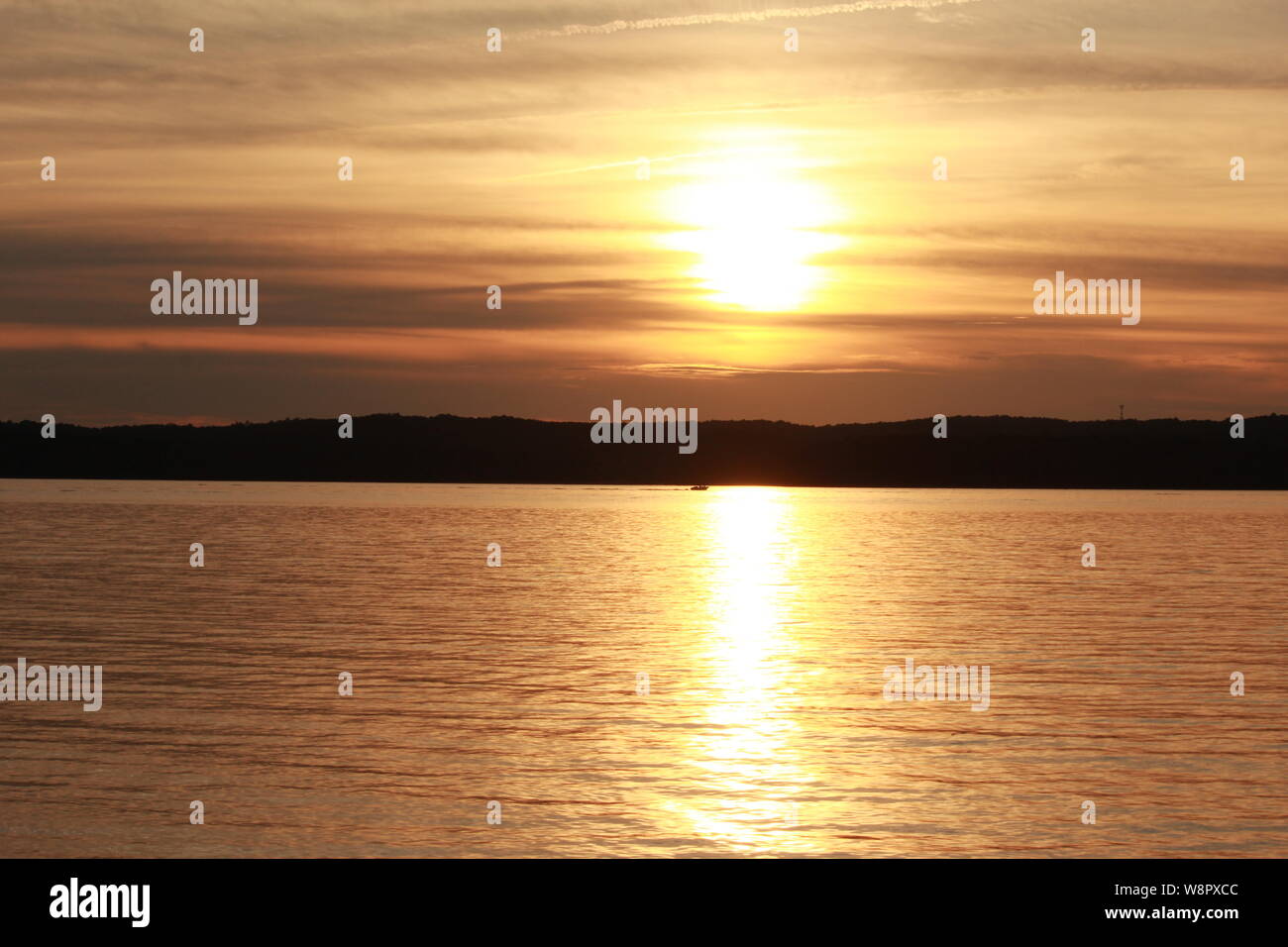 Sequence of sunset over the lake from same vantage point Stock Photo