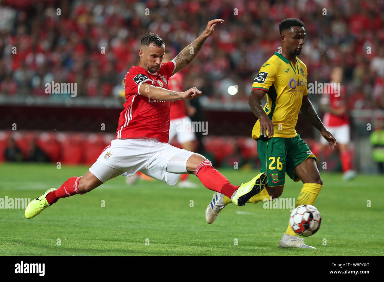 Lisbon, Portugal. 10th Aug, 2019. Benfica's Haris Seferovic (L) vies with Pacos de Ferreira's Maracas during the Portuguese league football match between Benfica and Pacos de Ferreira in Lisbon, Portugal, on Aug. 10, 2019. Credit: Petro Fiuza/Xinhua/Alamy Live News Stock Photo