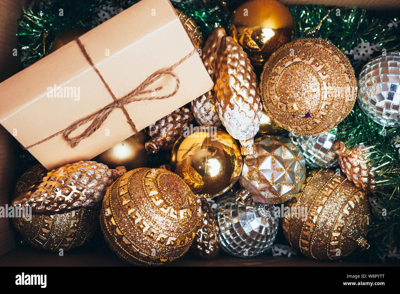 From above view of gleaming Christmas decorations and wrapped gift ...