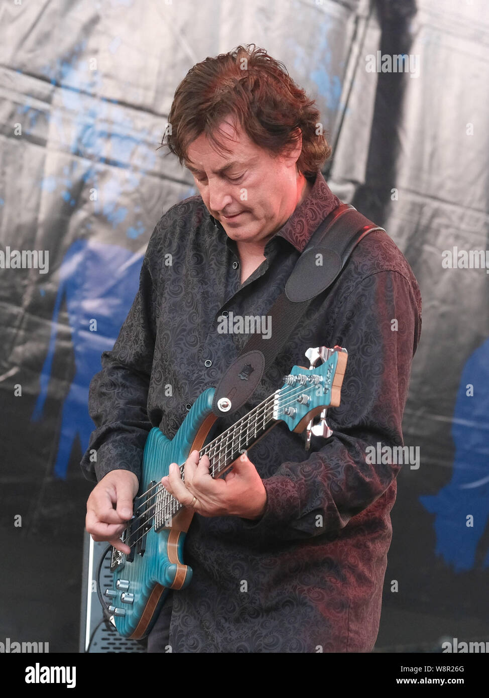 Alan Thomson, Scottish bassist performs with Martin Barre Band during the Fairport Convention's 40th anniversary at Cropredy Festival in Banbury. Stock Photo