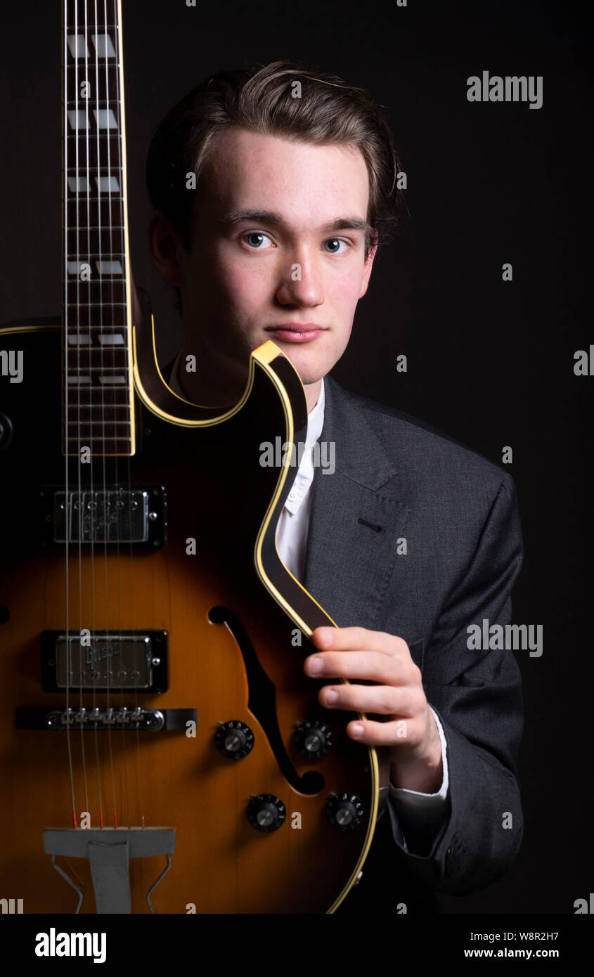 Portrait of young 17 year old music student with guitar Stock Photo