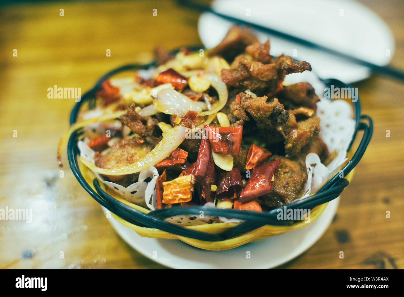Sichuan spicy fried chicken cube, a common dish in china restaurant. Stock Photo