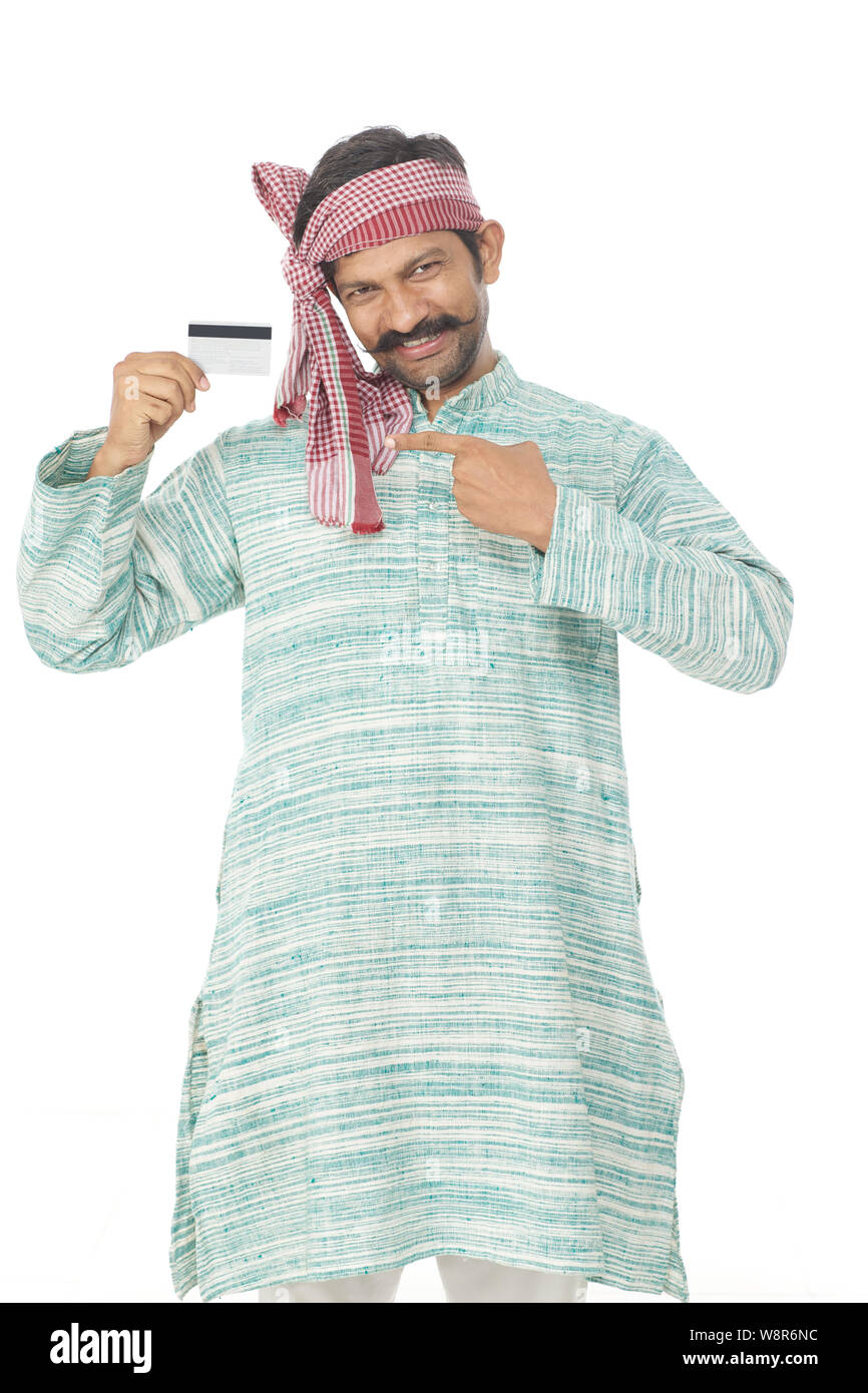 Rural man smiling and showing credit card Stock Photo - Alamy