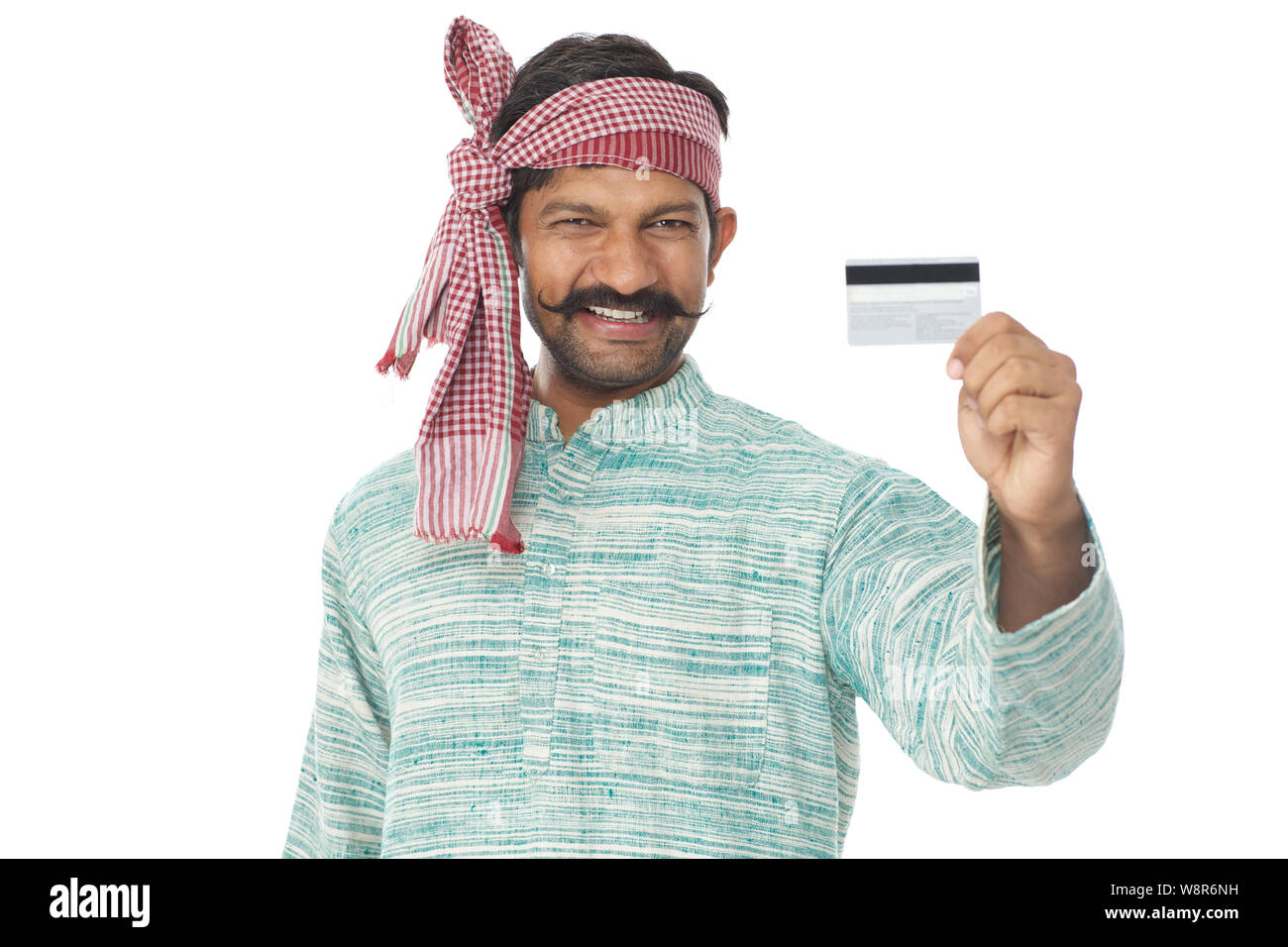Rural man smiling and showing credit card Stock Photo - Alamy