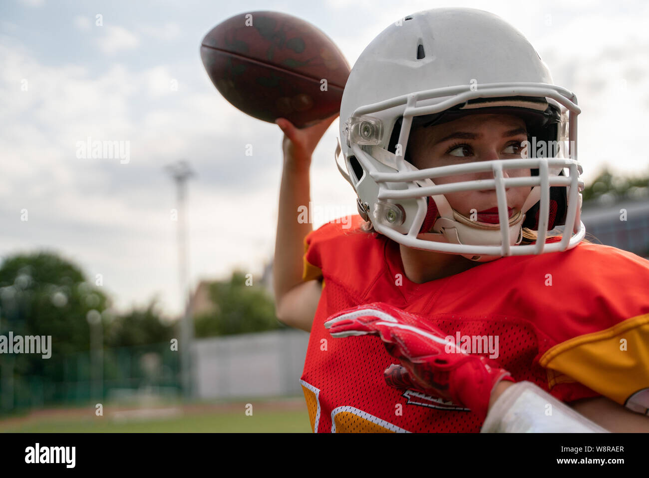 American football player throwing ball hires stock photography and