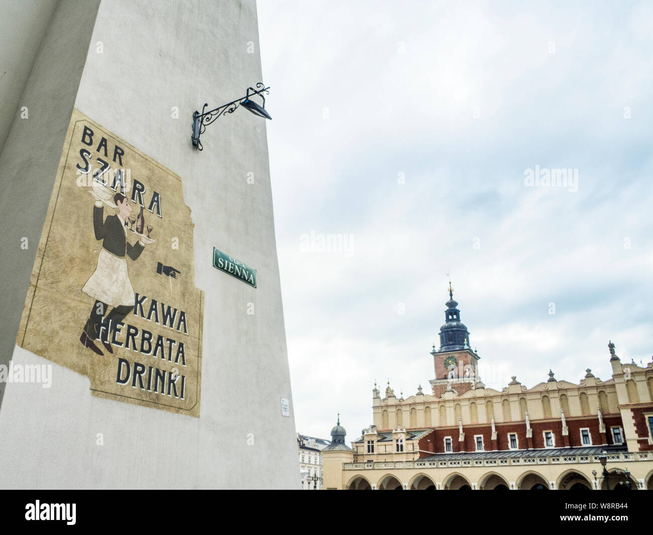 Krakow, Poland-June 10,2015: weathered sign with a direction arrow  to a bar Stock Photo