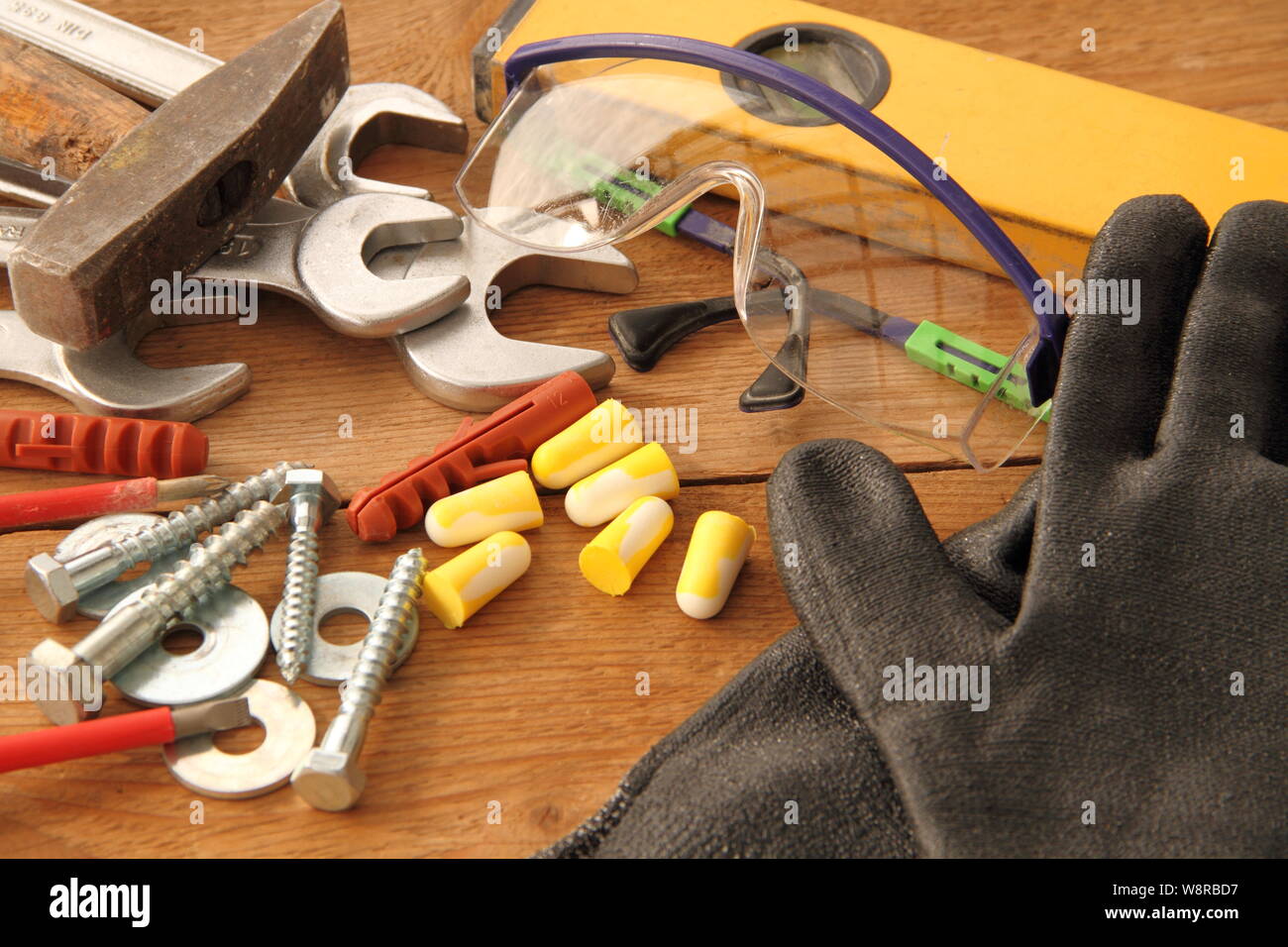 Gloves with tool on a workbench Stock Photo Alamy