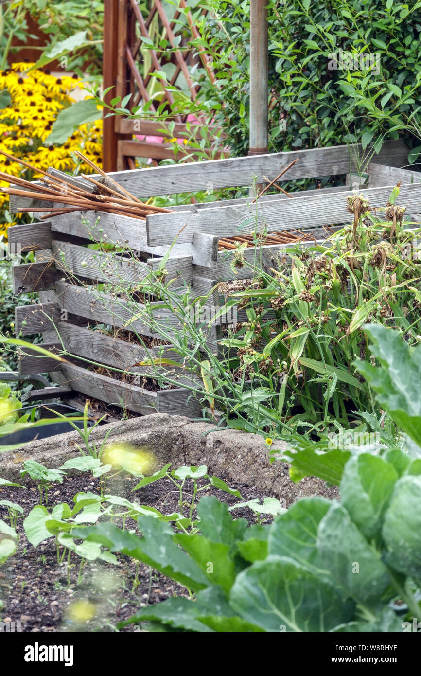 Wooden composter, compost heap in allotment garden bin Stock Photo Alamy