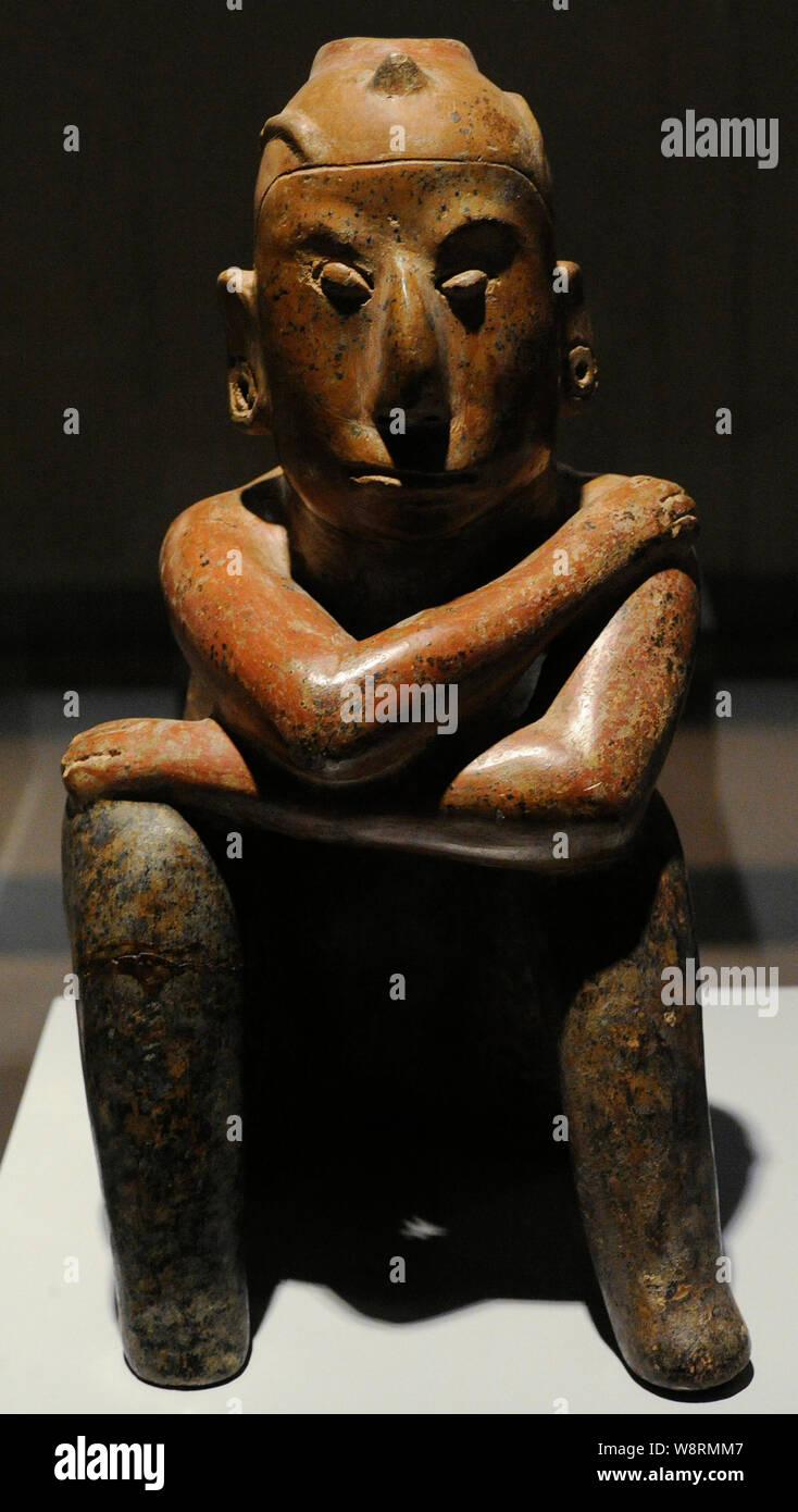 Vessel shaped human figure sitting. Ceramic. Colima style. Ancient and Middle Classic Period (100-700 AD). Western Mexico. Museum of the Americas, Madrid, Spain. Stock Photo