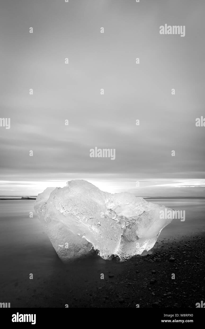 Iceberg in a black sand beach, reminding of a diamond, in Iceland Stock Photo