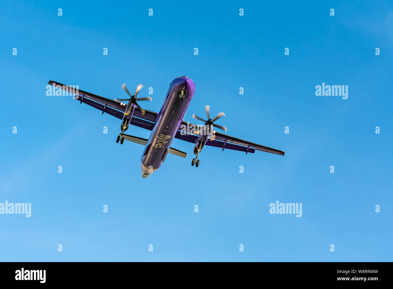 London, UK - 17, February 2019: Flybe a British regional airline based in England, aircraft type De Havilland Canada DHC-8-400 Fly on blue sky Stock Photo