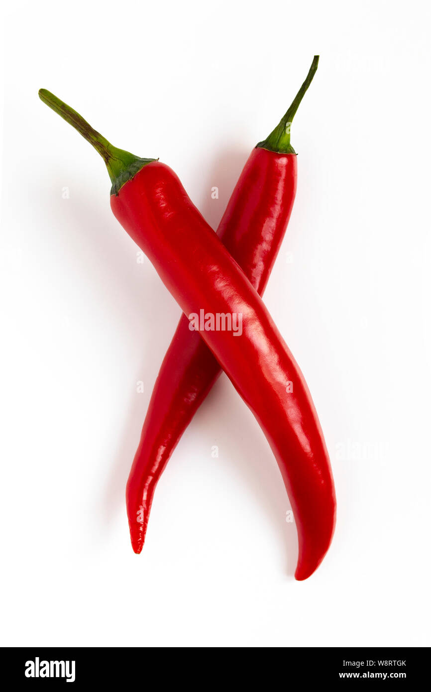Two red hot chili peppers lie crosswise on a white background. Beautiful red hot with a flare. Seasoning vegetables Hot Jalapeno Peppers Stock Photo - Alamy