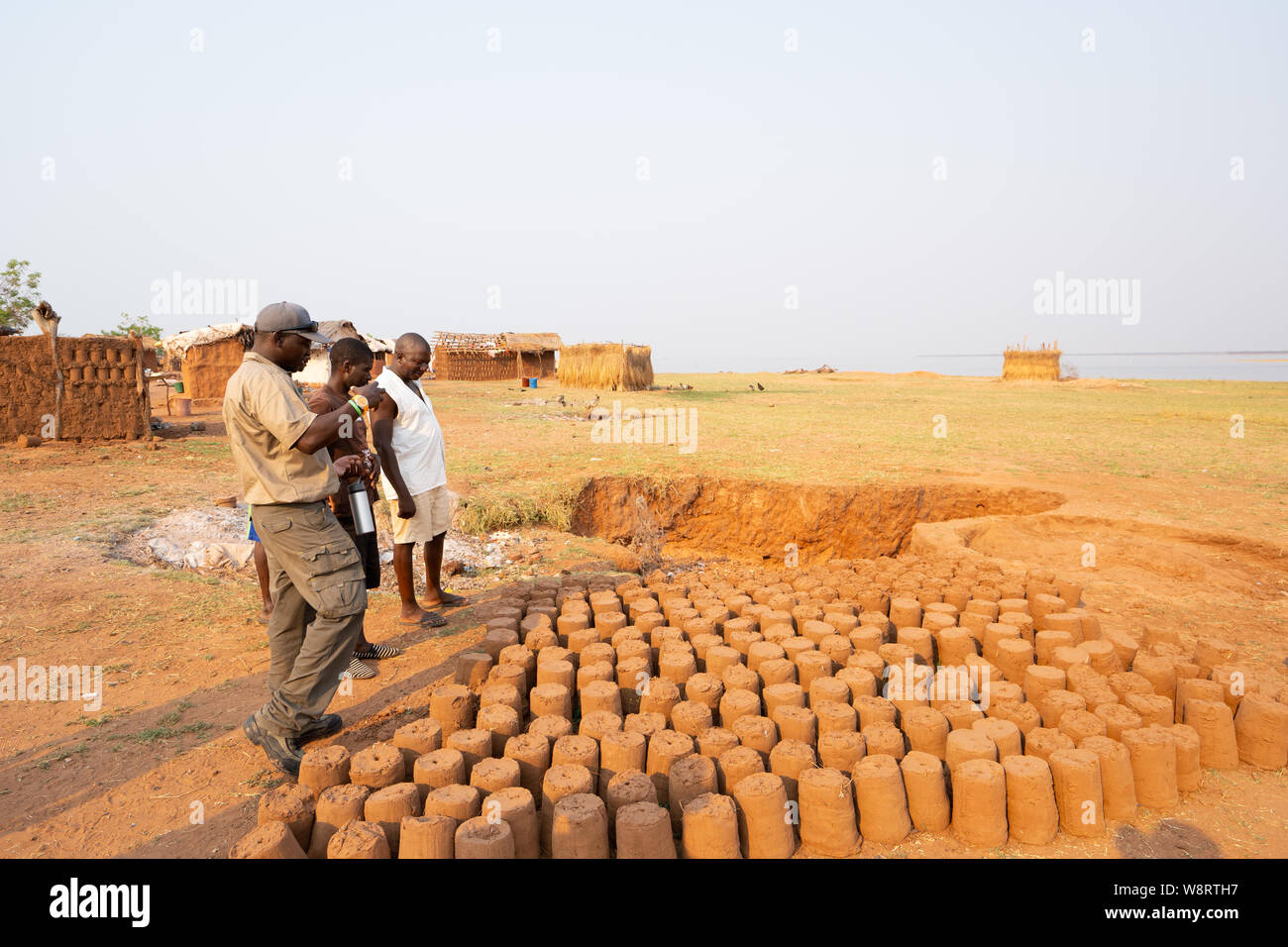 Mud bricks for building houses are sun dried at a Tonga fishing village on Lake Kariba, Zimbabwe Stock Photo