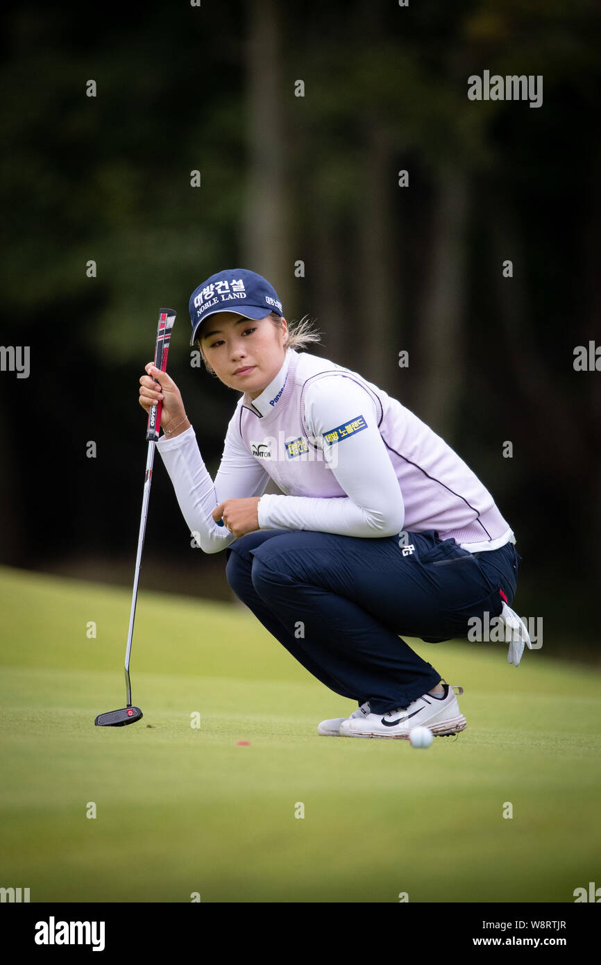 South Korea's Jeongeun Lee lines up her putt on the 1st green during ...