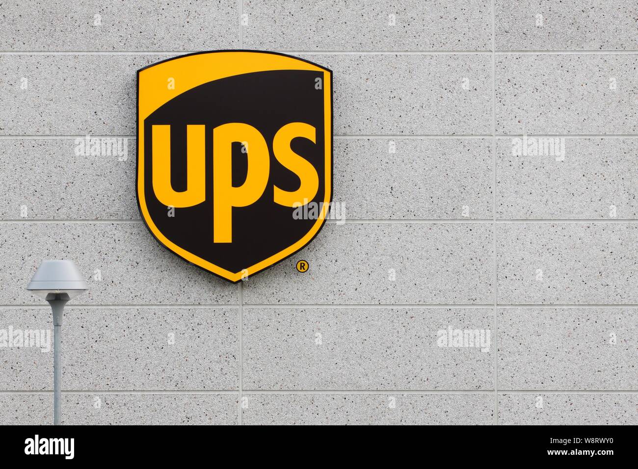 Vejle, Denmark - July 4, 2015: UPS (United Parcel Service) logo on a facade. United Parcel Service is the world's largest package delivery company Stock Photo