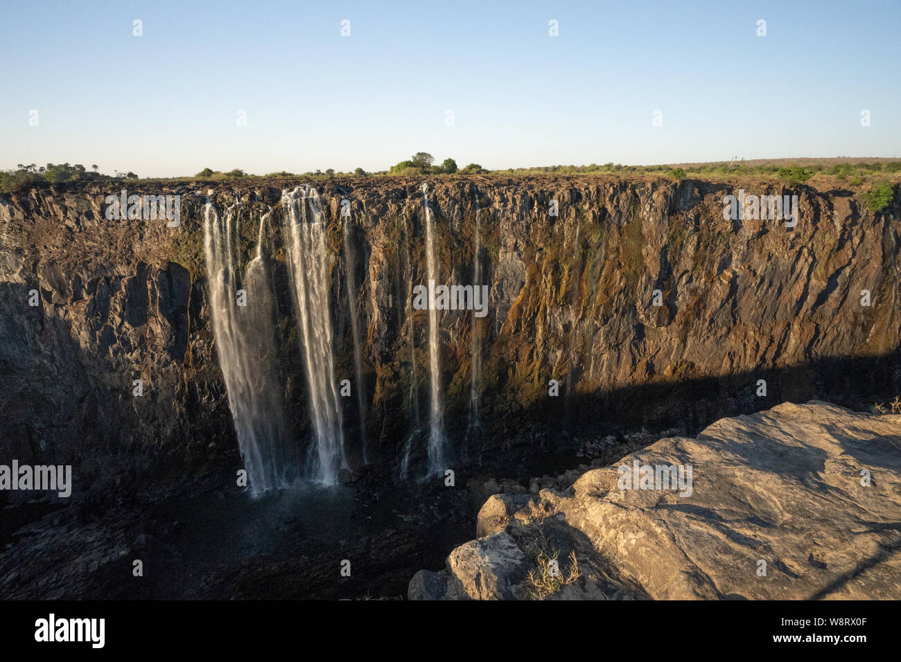 Victoria Falls, Named by David Livingstone in 1855 after Queen Victoria, The waterfall is formed by the Zambezi River falling into a 100 metre deep ch Stock Photo